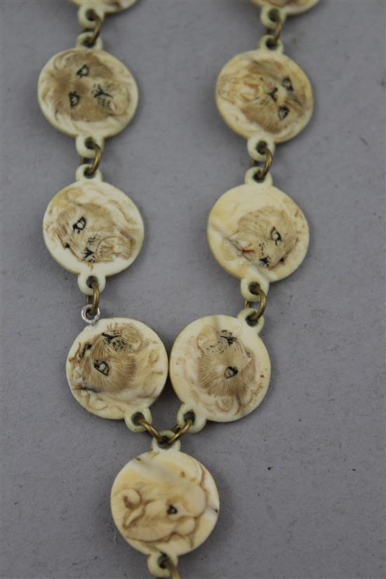 Two Japanese carved ivory necklaces, early 20th century,